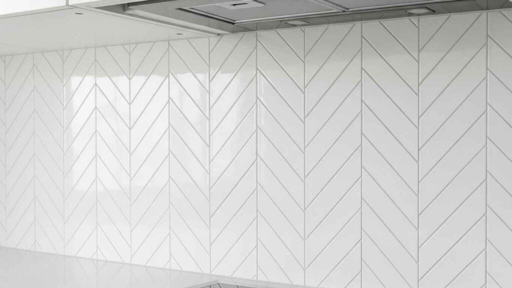 White Kitchen with Geometric Backsplash
